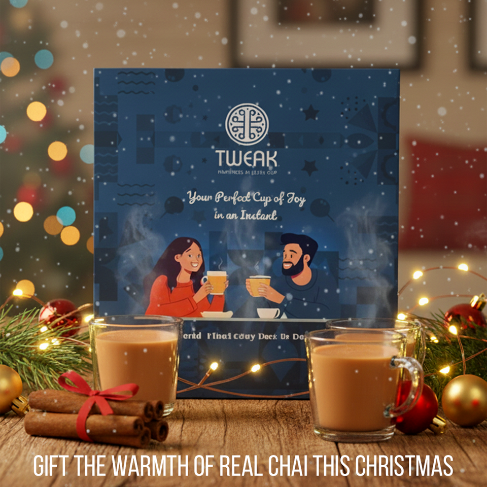 Tweak Chai festive box with two people enjoying chai, surrounded by Christmas decorations.