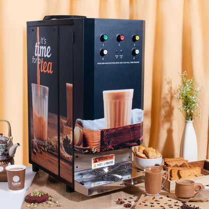 Tea-making machine with cups and snacks on a table against a beige curtain background